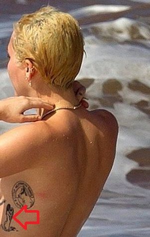 miley cyrus-naked woman tattoo