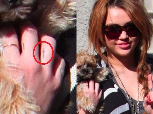 miley cyrus-tiny cross tattoo