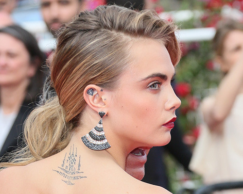 cara delevingne-sak yant tattoo