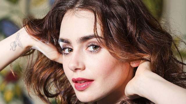 Lily Collins’ 4 Tattoos & Their Meanings