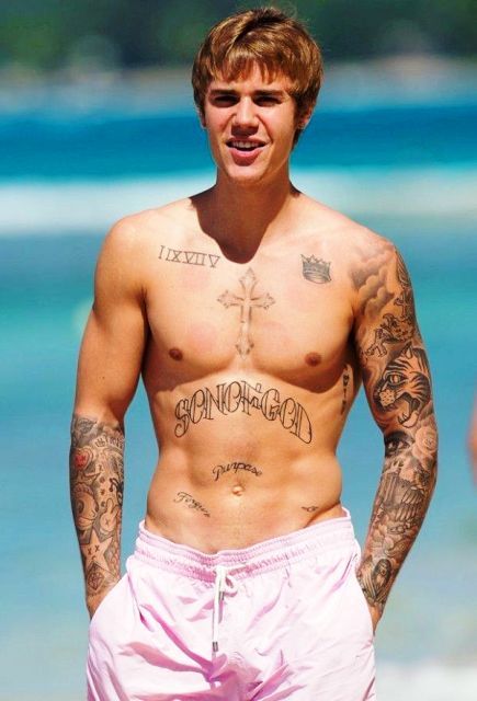 Justin Bieber Shares the Story Behind His Favorite Tattoos  Vogue