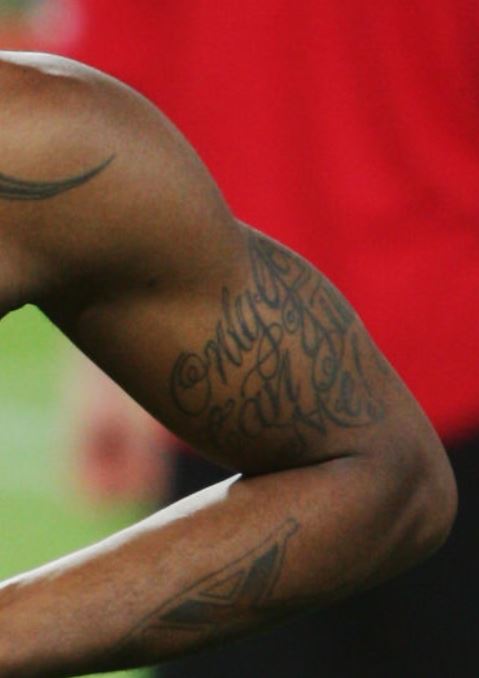 Djibril left arm wriitng tattoo