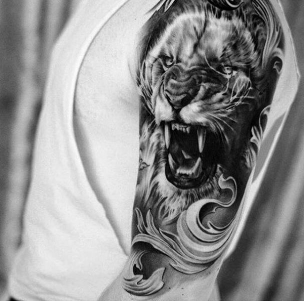 Black And Gray Lion Tattoo