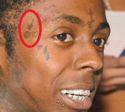 Lil Wayne Death wish Skateboard and Heart tattoo beside his right eye