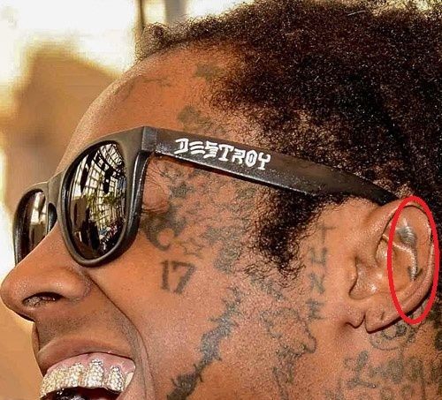 Lil Wayne Flower tattoo inside his ear