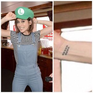 Lizzy Caplan's 2 Tattoos & Their Meanings - Body Art Guru