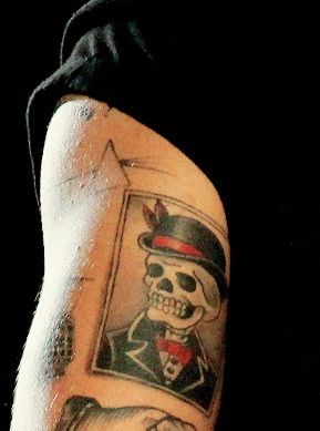 Harry Styles Skull with a Hat Tattoo-