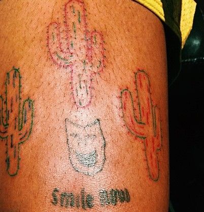 Travis Scott smile mood and cactus tattoo
