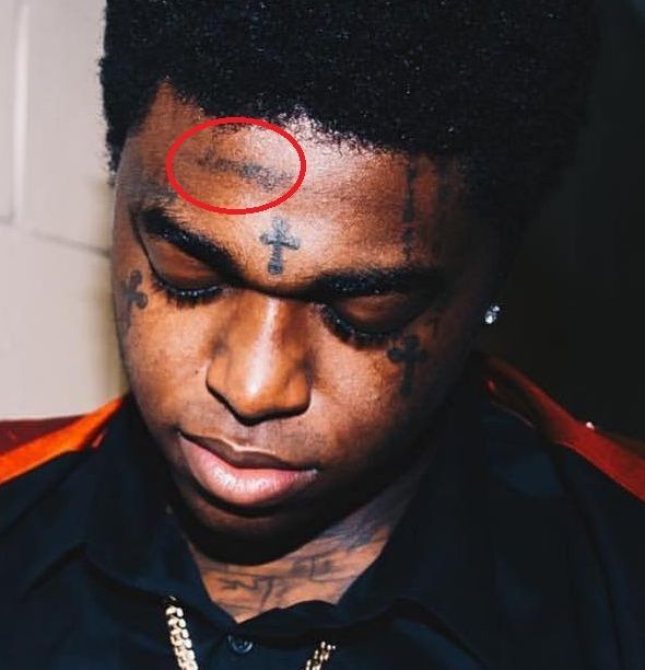 unknown tattoo on forehead-kodak black tattoo. 