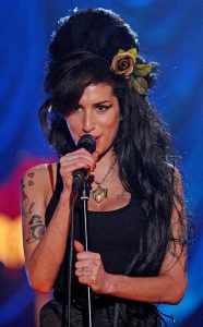 Amy Winehouse's 11 Tattoos & Their Meanings - Body Art Guru