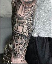 J. J. Redicks Left Arm Bull tattoo