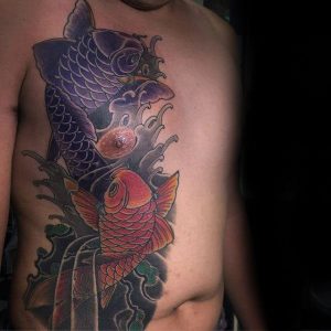 gentleman with japanese koi fish pisces chest tattoo compressed 1