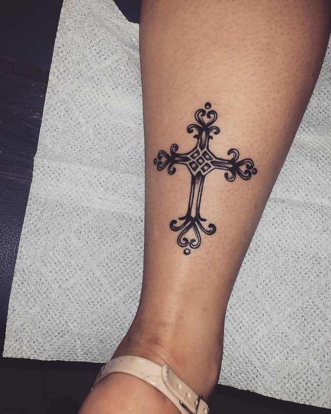 Cross with rose and vines tattoo