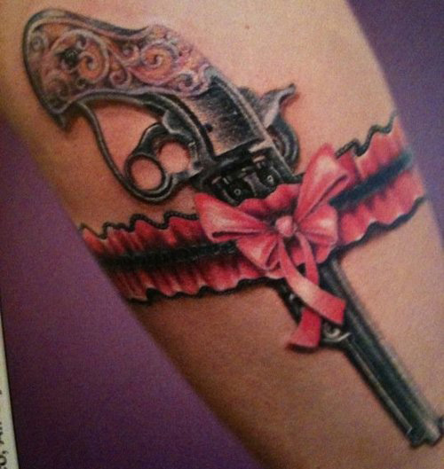 gun tattoos on hips for women