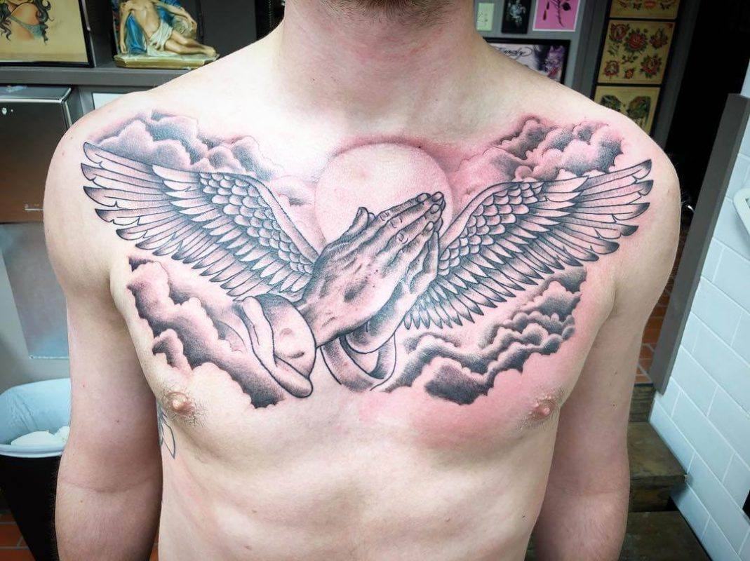 praying hands tattoo with angel wings