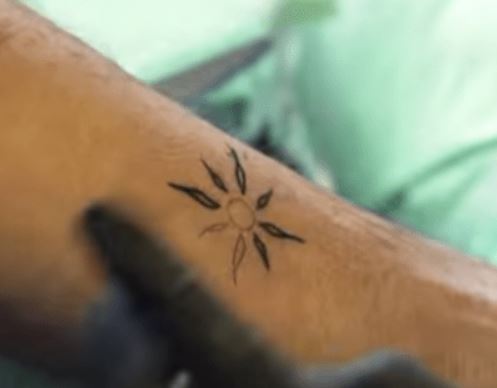 Anthony left arm star tattoo