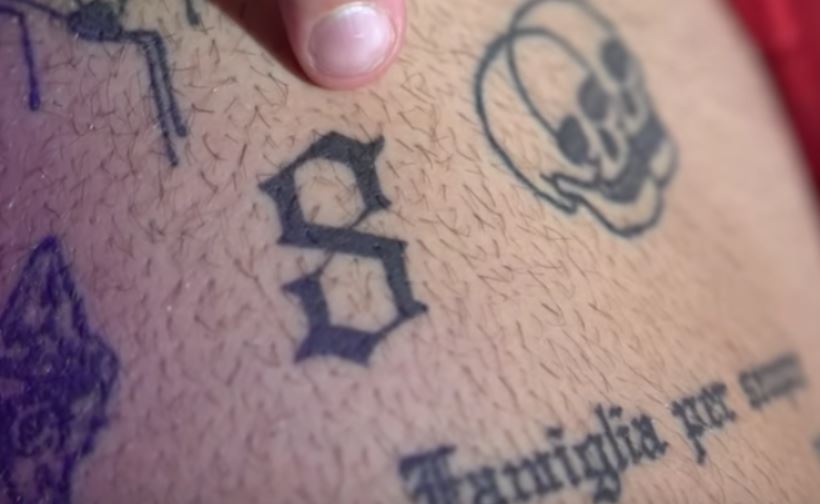Ethan 8 and skulls tattoo