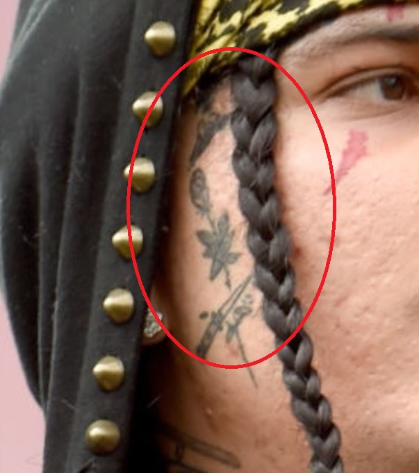 Sosmula face tattoo