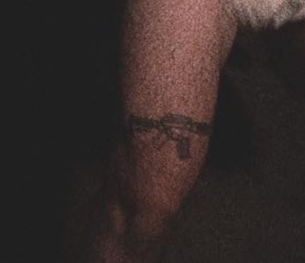 Joji gun tattoo