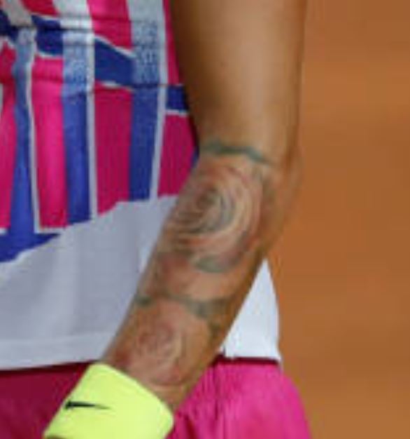 Polona left arm roses tattoo