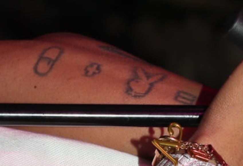 Tyla symbols on arm