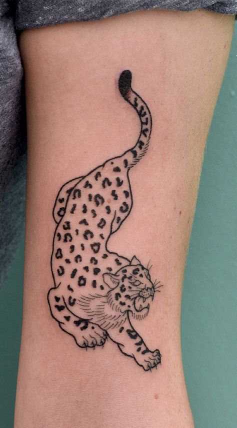 snow leopard tattoo arm