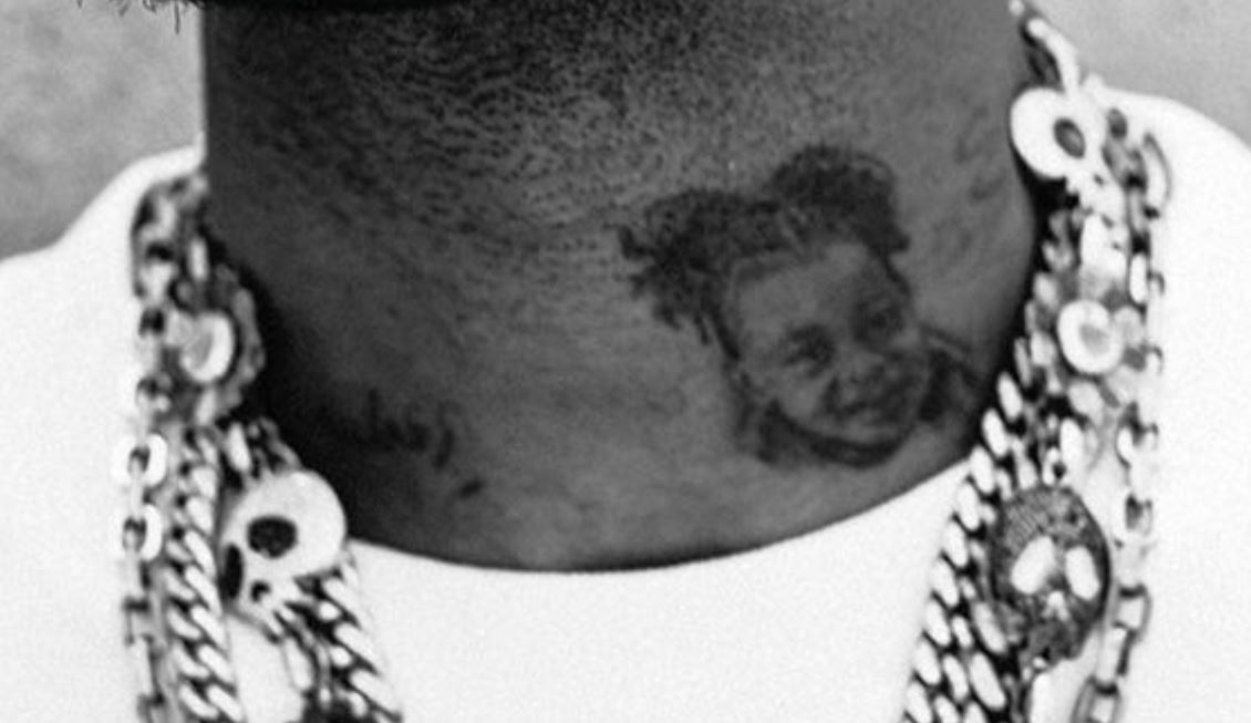 Kid neck portrait tattoo