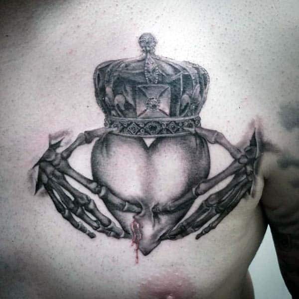 19 gentleman with skeleton hands claddagh irish tattoo on upper chest