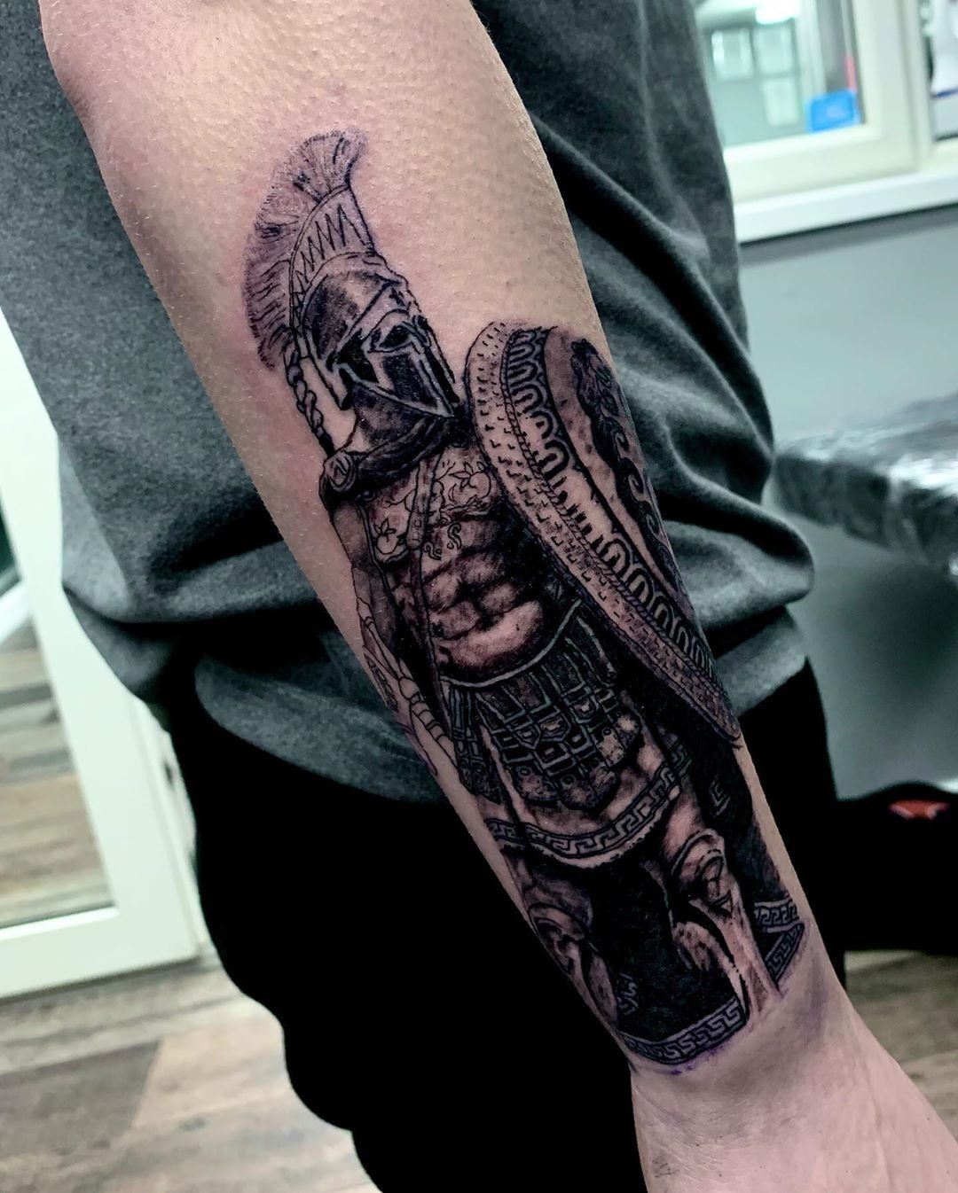 Spartan Helmet And Sword Tattoo