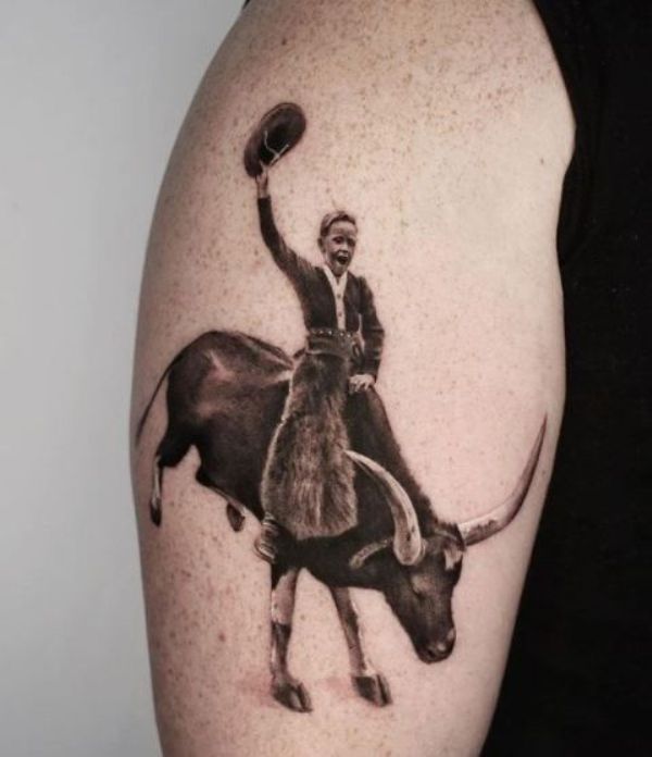 'A Boy riding on a Bull' Tattoo