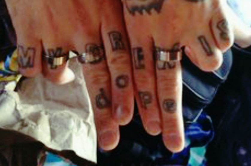 Johnny finger letters tattoo