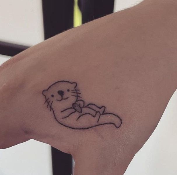 Tiny Otter Tattoo