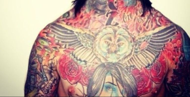 Ronnie roses on chest tattoo