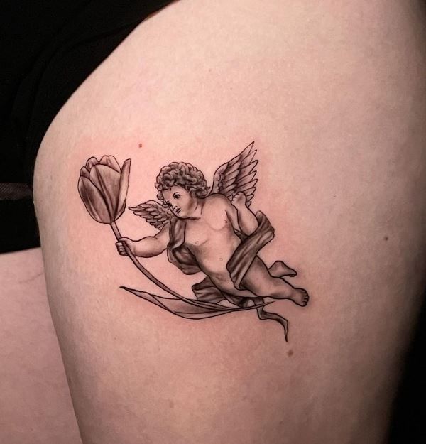 Angel holding a Tulip Tattoo Design on Thigh