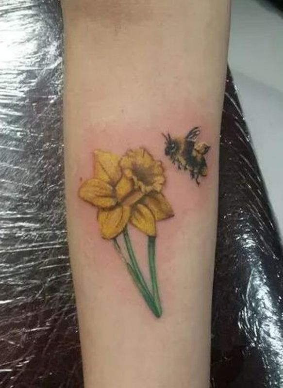 Daffodil With Bee Tattoo Design On Arm