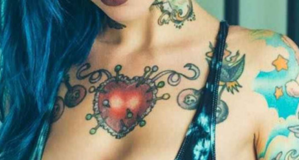 Riae heart with nails tattoo