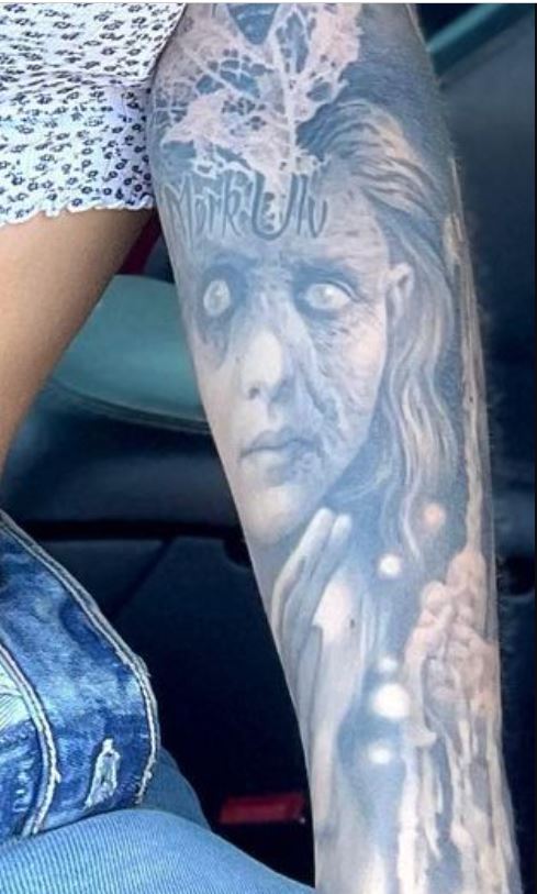 Viking portrait on left arm