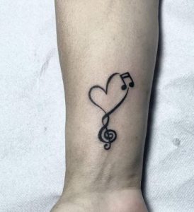 20 Amazing Musical Notes Tattoos Designs With Meanings Ideas And Musical Note Tattoo With The Heart On The Wrist 274x300