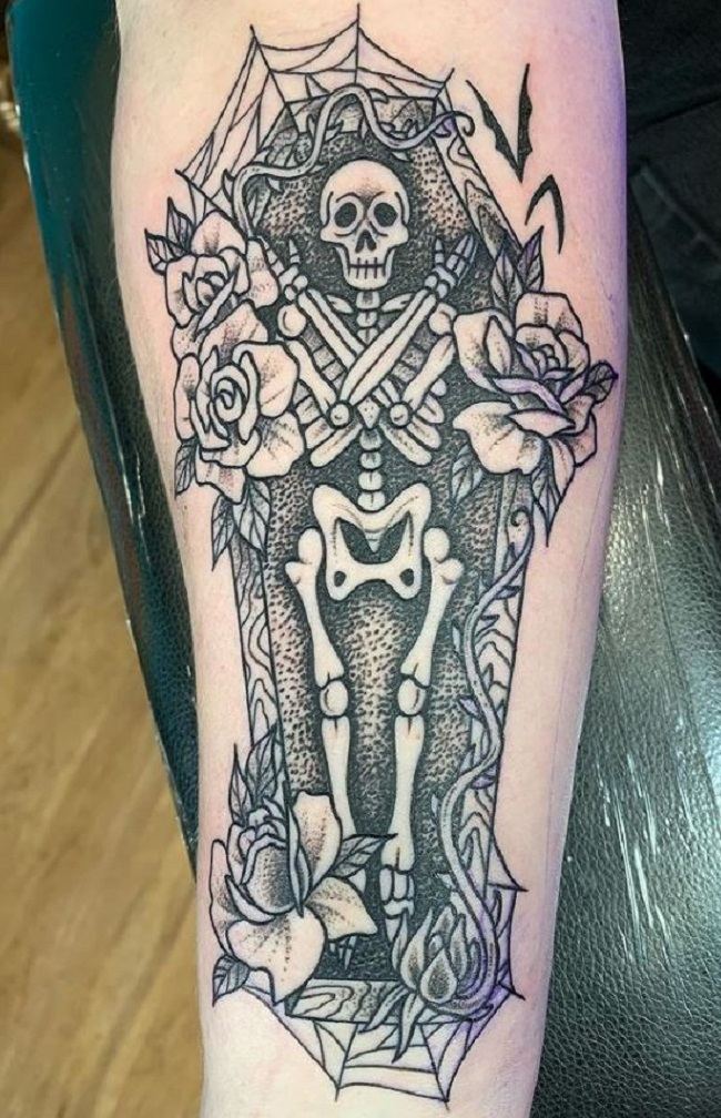 A Coffin With a Skeletal Tattoo