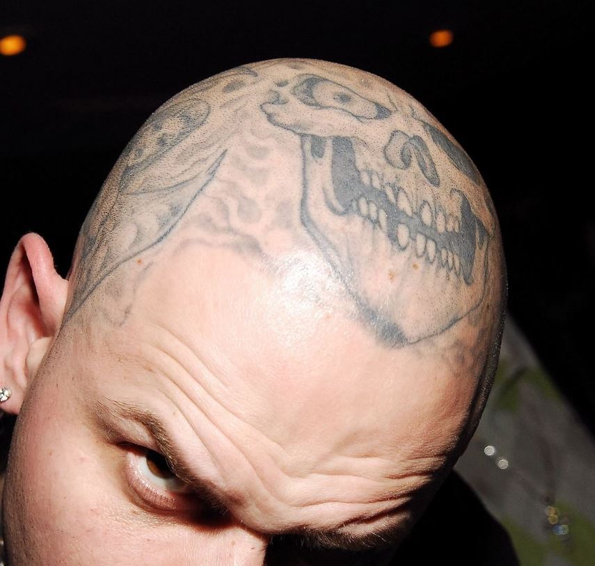 Robert skull on head tattoo