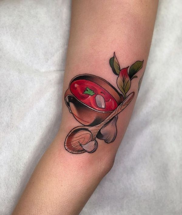 A Cup of Tomato Soup Tattoo Design on the Forearm