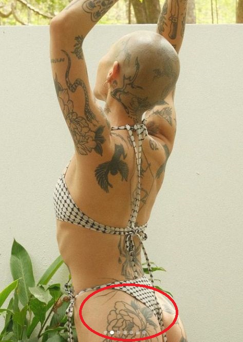 Floral tattoo on buttocks